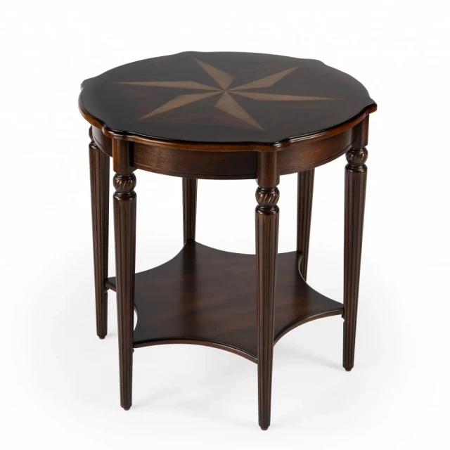 Brown round coffee table with wood stain finish and art detail