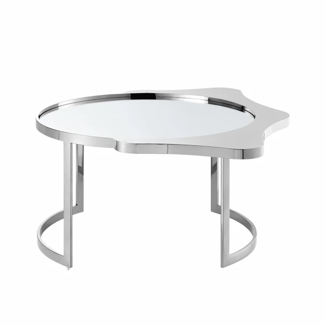 Stainless steel round mirrored coffee table in a modern furniture setting