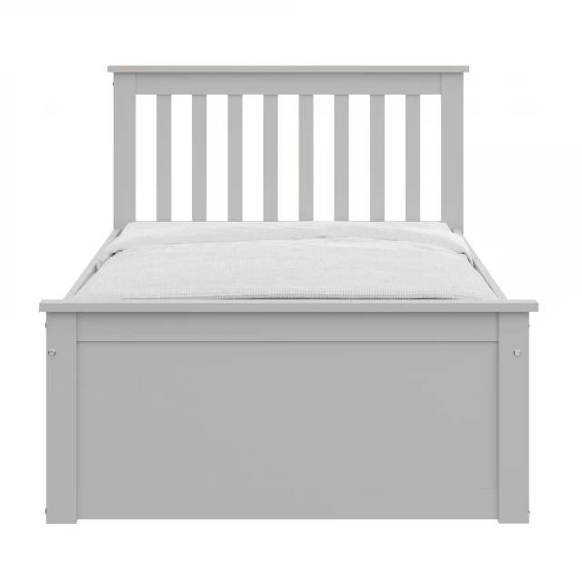 Solid wood twin bed with pull-out trundle for space-saving bedroom furniture