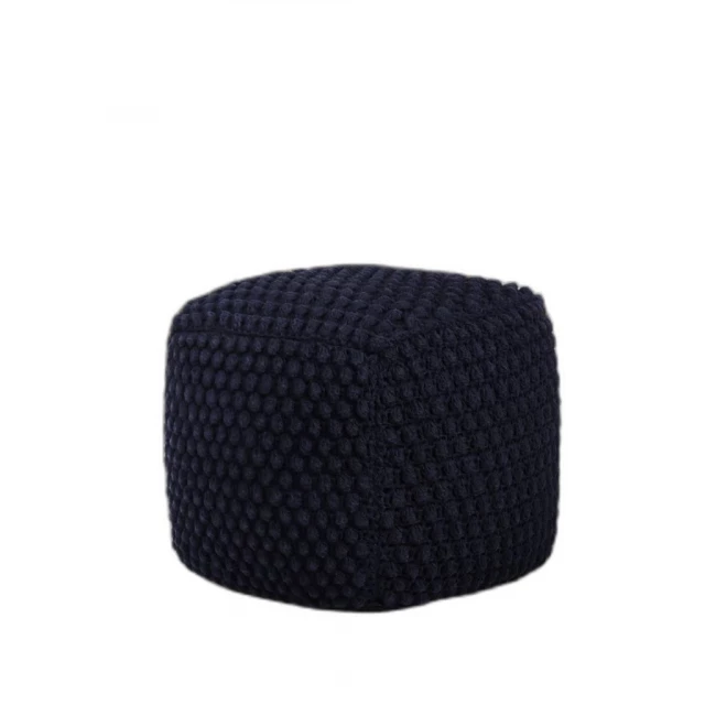Navy blue cotton blend pouf ottoman in a cozy room setting