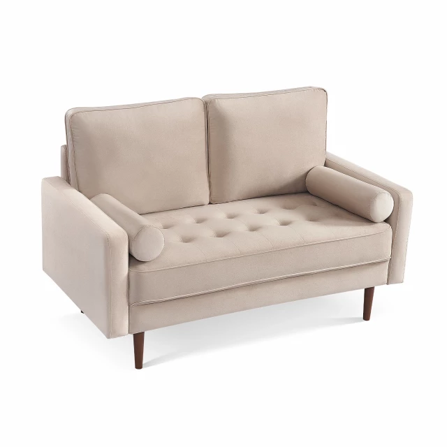 Dark brown velvet loveseat with toss pillows and wooden legs