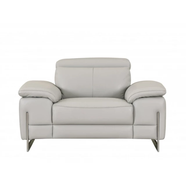 Light grey tasteful leather chair with armrests and comfortable studio couch design in furniture category