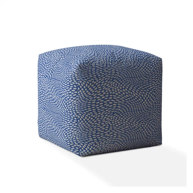 White canvas polka dots pouf ottoman with pattern design in a home setting