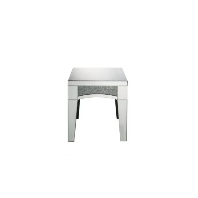 Mirrored manufactured wood square end table with metal accents in a furniture setting