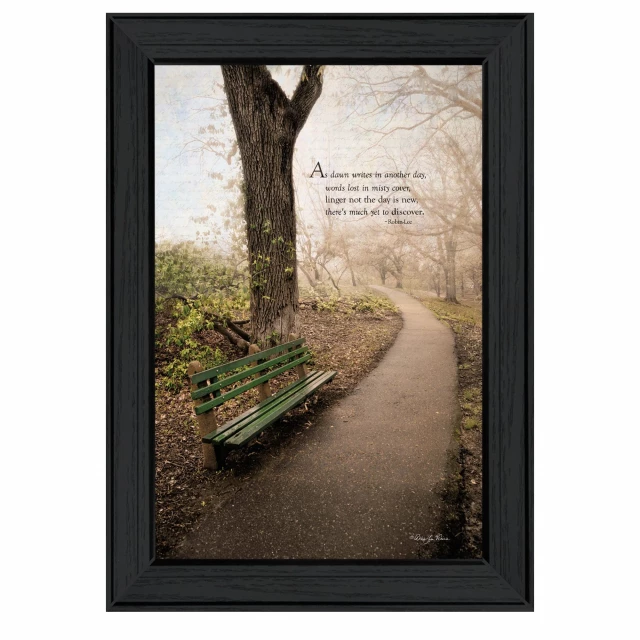 Black framed print of a natural landscape with trees and grass