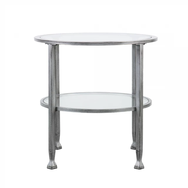 Silver glass iron round end table in a setting with wood elements and plant decor