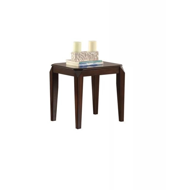 Dark brown solid wood end table with tableware and drinkware on top in a furnished room