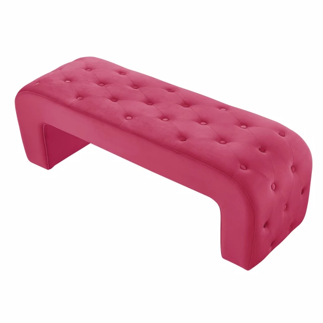 fuchsia upholstered velvet bench against brick flooring with magenta accents
