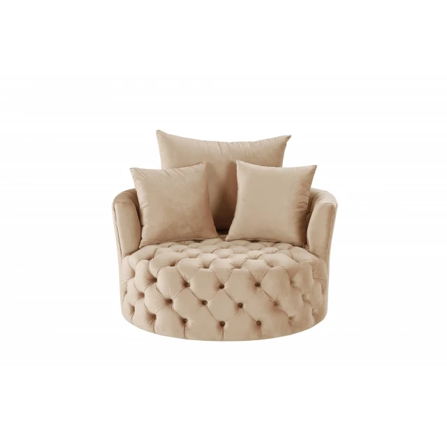 Beige velvet solid swivel barrel chair with throw pillow in a comfortable seating arrangement
