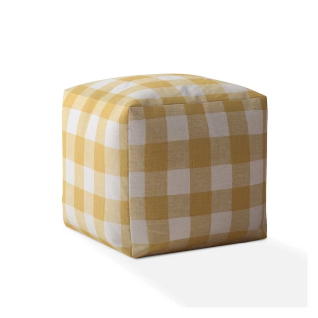 Yellow and white canvas gingham pouf cover with beige tones and wood texture accents