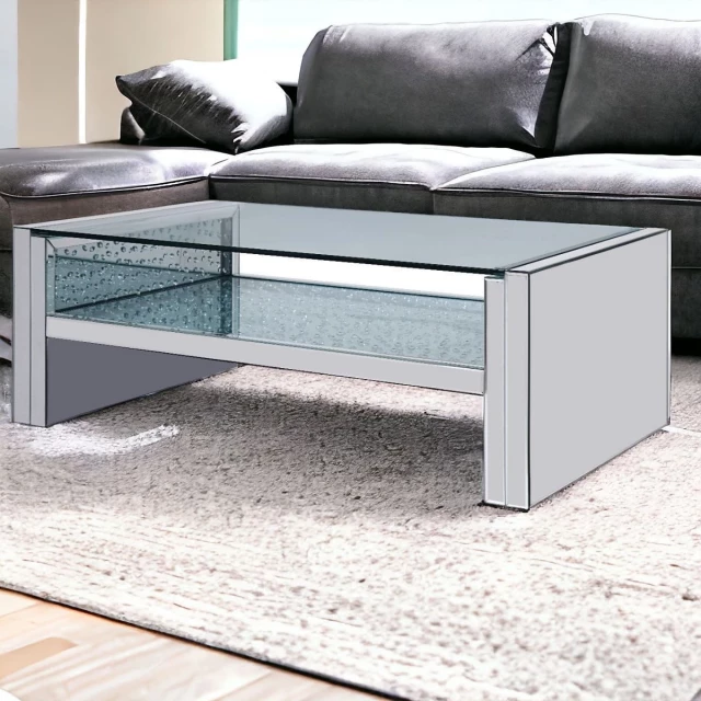 Silver glass mirrored coffee table with shelf in a modern furniture setting