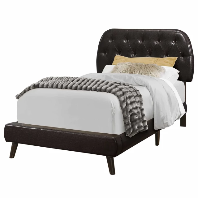 Tufted black standard bed with upholstered headboard in elegant bedroom setting