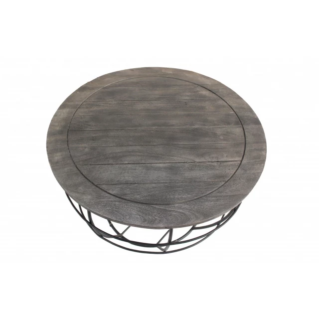 cast iron round distressed coffee table with circle and rectangle design elements