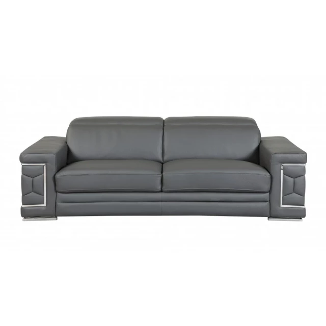 Gray silver Italian leather sofa with wood accents and comfortable studio couch design in a modern setting