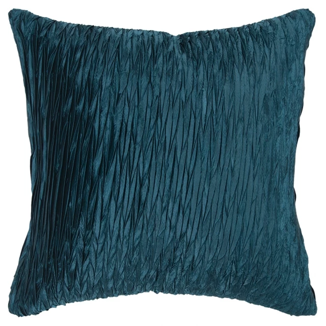Blue crinkle down filled throw pillow on grey couch with azure and textile details