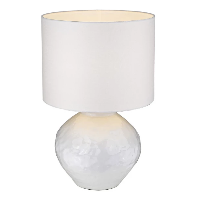 column table lamp with white drum shade on table