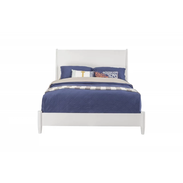 White solid manufactured wood king size bed in a bedroom setting