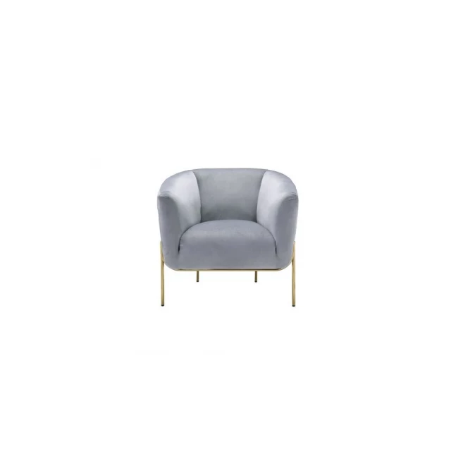 Gray velvet gold solid barrel chair with armrest and wood flooring