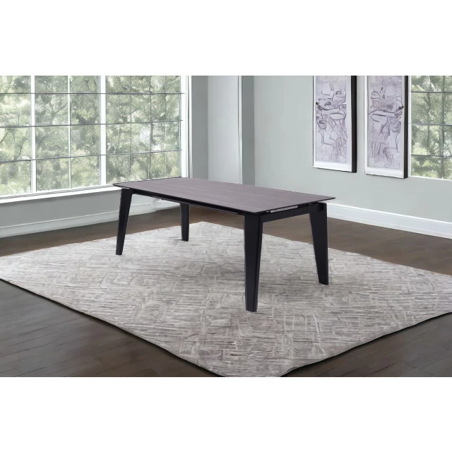 Solid wood drop leaf dining table with interior design elements including wood flooring and window