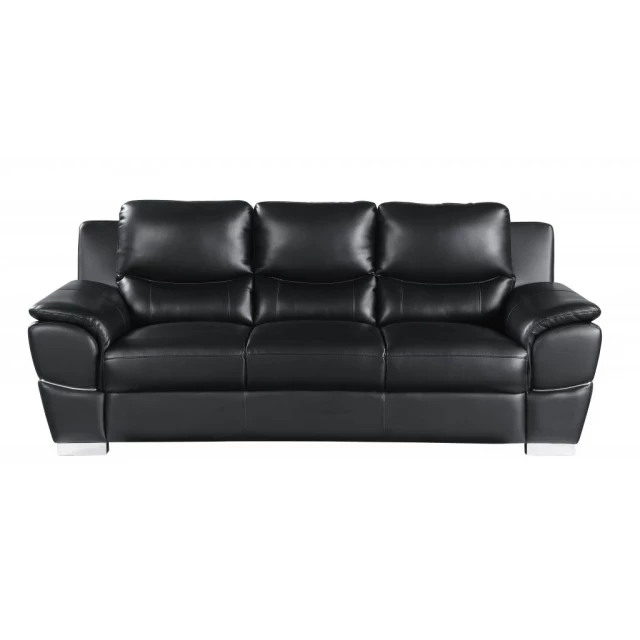 Black silver leather sofa with brown wood accents in a studio couch style for modern comfort and elegance