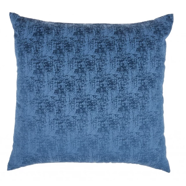 navy blue distressed gradient throw pillow on aqua chair with azure and grey textile design