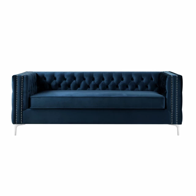 Navy blue velvet silver sofa with electric blue accent and modern studio couch design