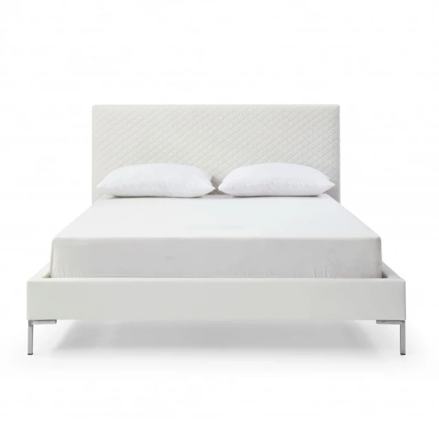 White upholstered faux leather bed frame in modern bedroom setting