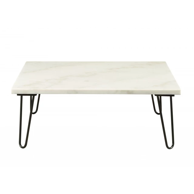 Black faux marble iron coffee table in a modern outdoor furniture setting