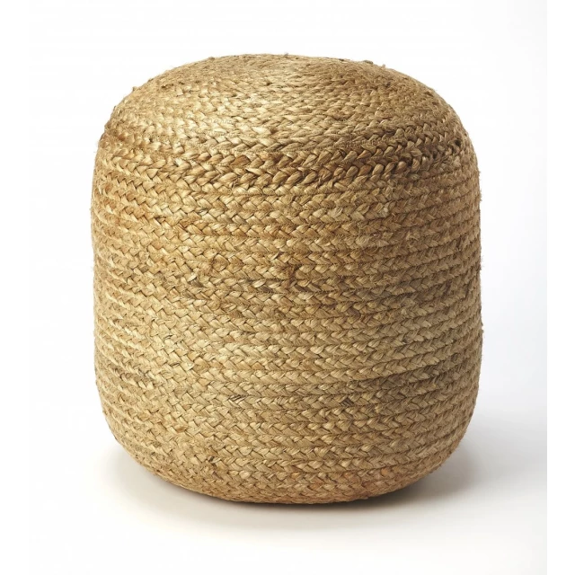 Jute round pouf ottoman in a natural wood setting with wicker art details