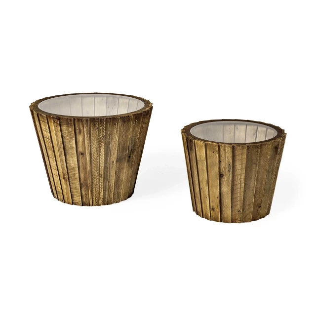 Brown wood accent tables with glass top and decorative items including flowerpot and drinkware