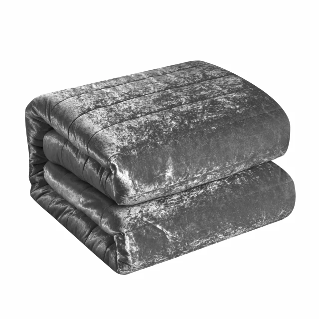 Polyester thread count washable down comforter on a brick background