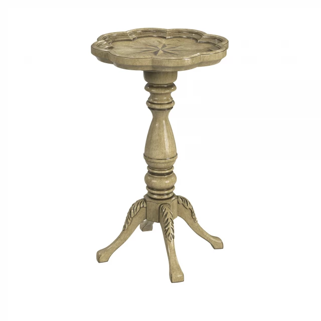 Beige manufactured wood round end table with metal accents in a furniture setting