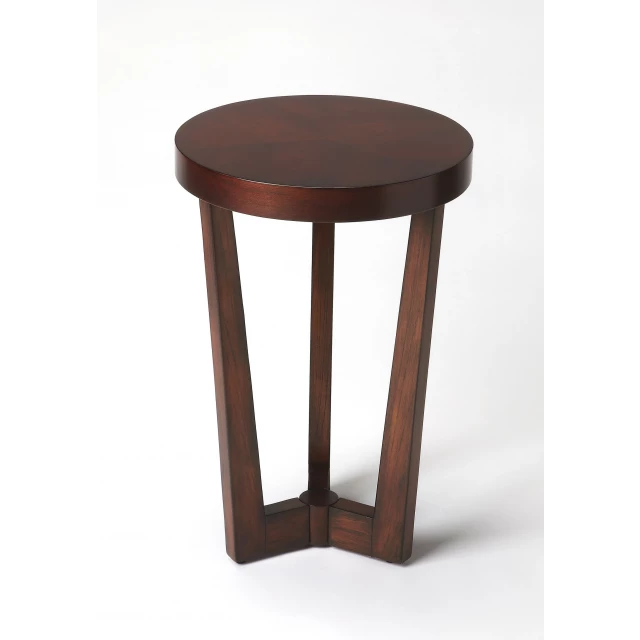 Cherry manufactured wood round end table in a natural setting