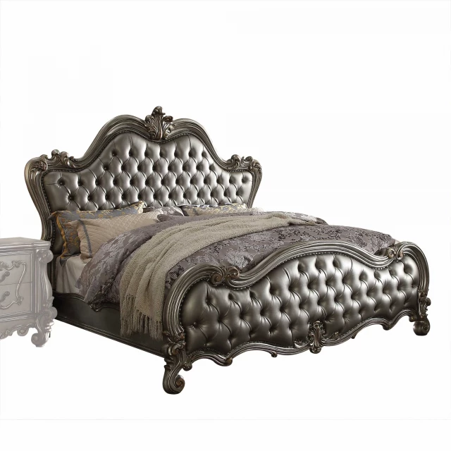 Upholstered faux leather bed with nailhead trim