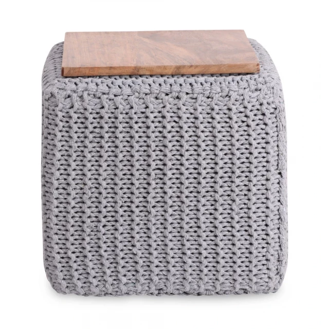 Gray cotton blend brown pouf ottoman in a cozy room setting with wood accents