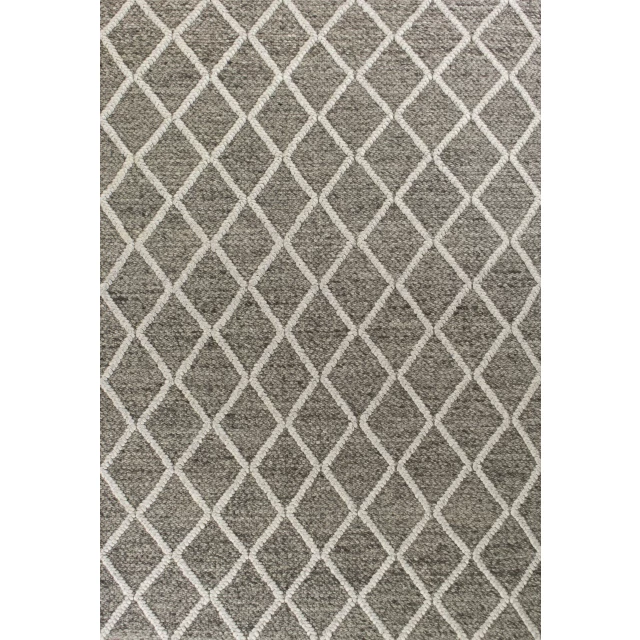 woven diamond pattern indoor area rug on beige flooring
