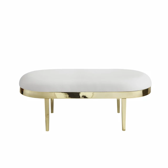 White gold upholstered faux leather bench in a modern design with wood accents