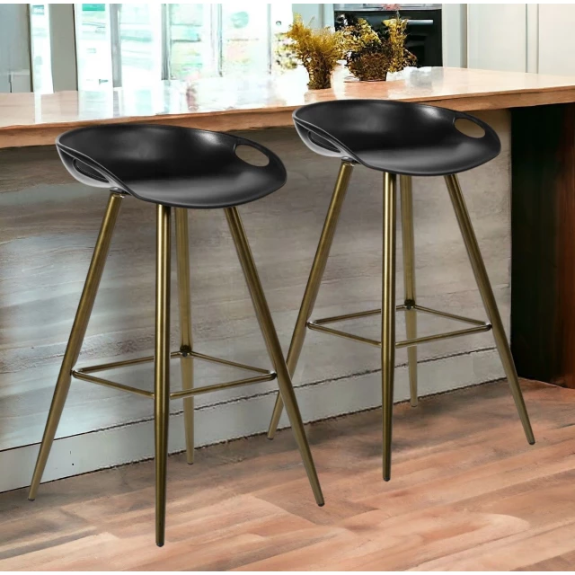 Low back counter height bar chairs in a light wood finish with sleek lines and modern interior design appeal