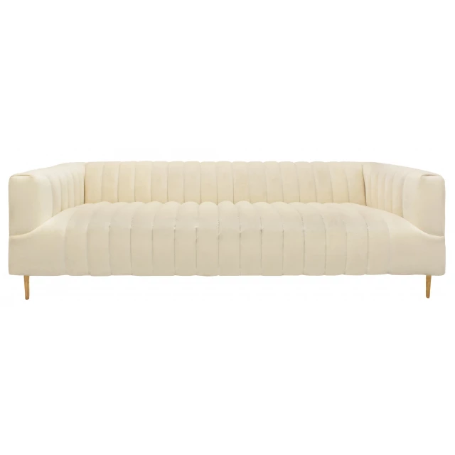 Ivory channeled velvet gold sofa on clean natural wood flooring