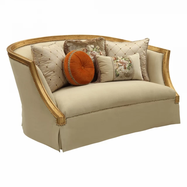 Polyester blend curved loveseat with toss pillows and wooden futon pad in outdoor setting