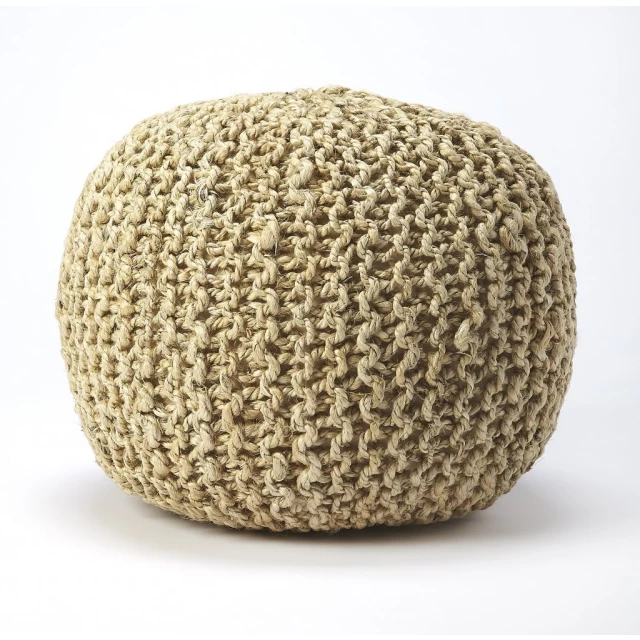 Natural jute round pouf ottoman in a cozy interior setting