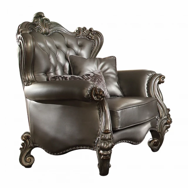Platinum faux leather tufted wingback chair with comfortable armrests in a studio setting