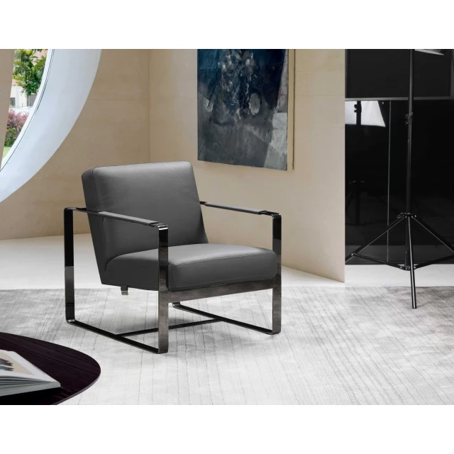 dark gray leather accent chair with wood accents in an interior design setting