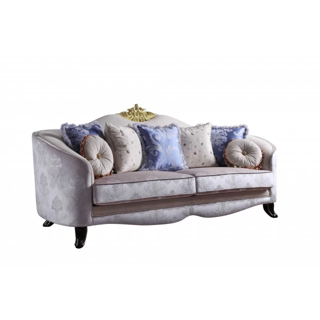 Cream fabric upholstery sofa with pillows and natural wood accents
