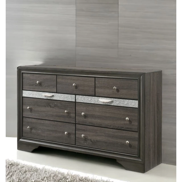 Manufactured wood nine drawer triple dresser in bedroom setting