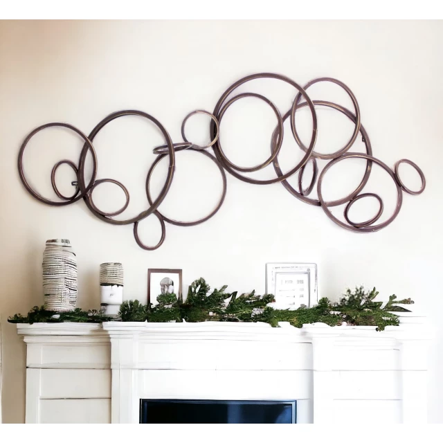 bronze metal wall decor with plant and flowerpot background