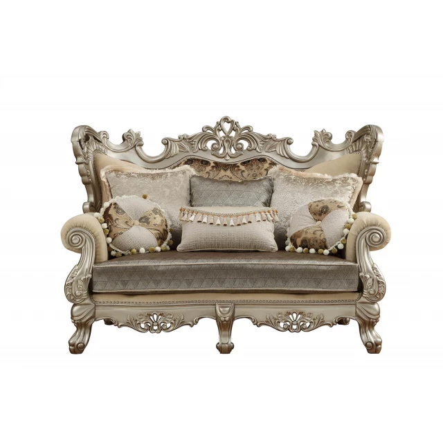 Blend damask chesterfield loveseat with toss pillows and antique metal accents in furniture fashion