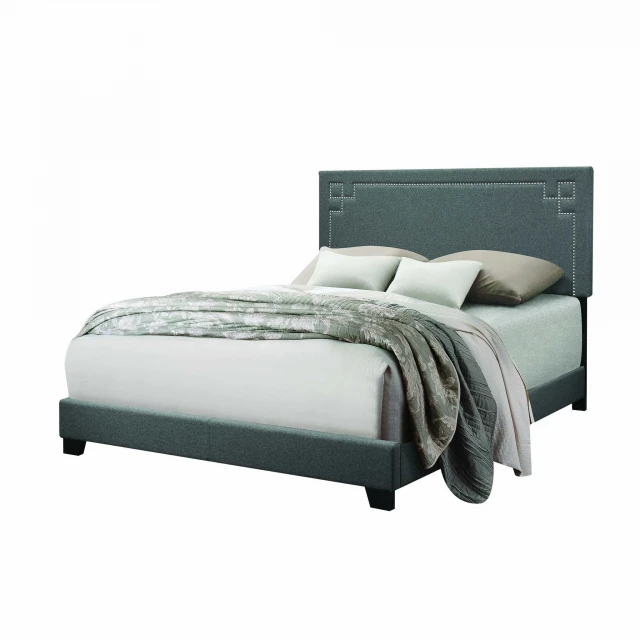 Contemporary gray upholstered king bed in a modern bedroom setting
