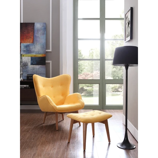 Yellow fabric wood tufted chair with matching ottoman in a cozy interior design setting