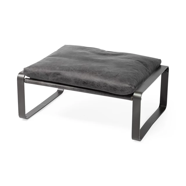 Black faux leather ottoman with wood and metal details